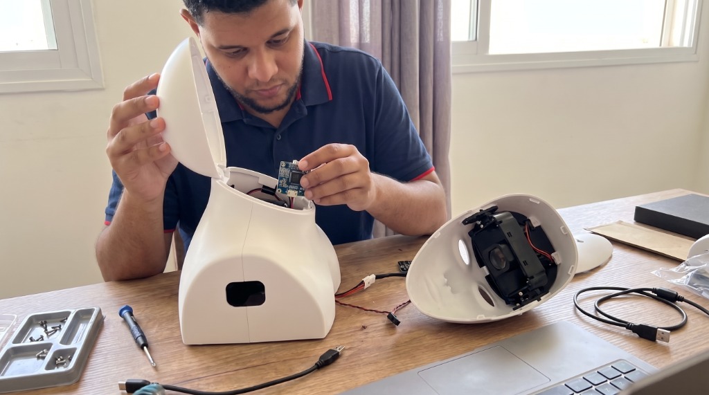 Bruno Melício assembling Furhat robot hardware and integrating multimodal perception systems